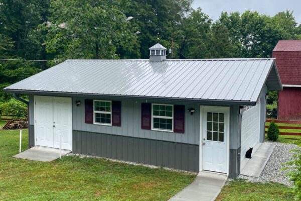 gray shed with metal roof white cupola